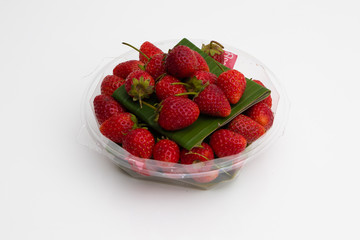 Fresh Red Strawberries on white plate on white background