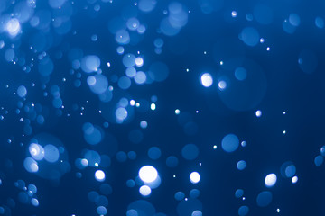abstract deep blue background with blur bokeh light effect