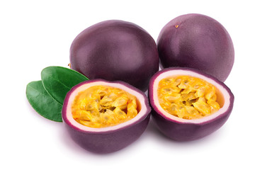 Two whole passion fruits and a half with leaves isolated on white background. Isolated maracuya