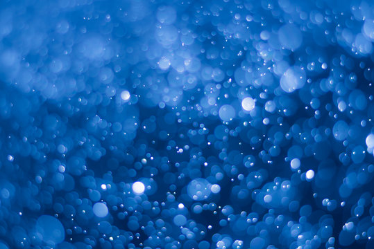 abstract deep blue background with blur bokeh light effect