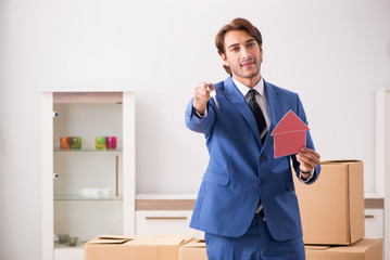 Young handsome realtor selling flat 