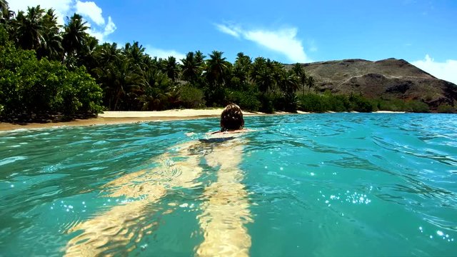 Tahuata Marquesas young female on deserted ocean beach
