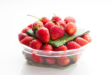 Fresh Red Strawberries on white plate on white background