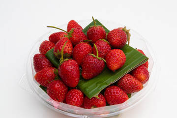 Fresh Red Strawberries on white plate on white background