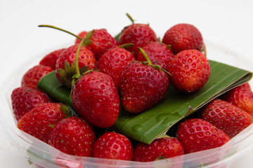 Fresh Red Strawberries on white plate on white background