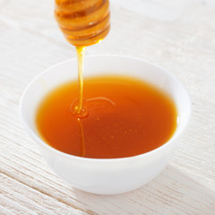 honey on white wooden table