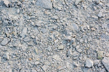 Crushed rock Different shapes and sizes for background . Stone gravel texture use for background, crushed rock for construction. pure gray rock. many rock background.