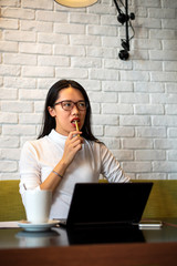 Girl solving problems and having a coffee