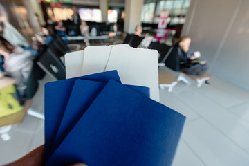 Three biometric passports with tickets for plane or boarding passes