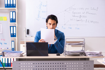 Male sales analyst in front of the whiteboard 