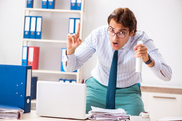 Businessman disgusted with cockroaches in the office