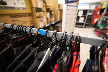 Details with clothes on hangers in a clothing store