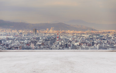 Obraz premium Osaka city skyline, downtown business district in sunset with empty concrete floor
