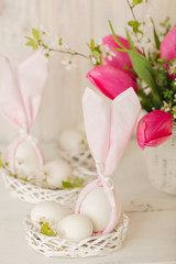 Fototapeta na wymiar Happy easter. Decor of Easter eggs in small white baskets.