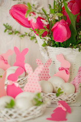 Obraz premium Happy easter. Decor of Easter eggs in small white baskets.