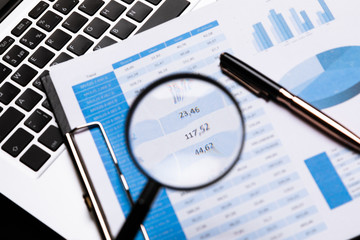 Office workplace with magnifier and stationery