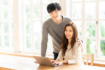 young asian couple relaxing in living room