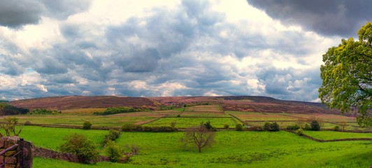 A panoramic view over the Peak District in Derbyshire on a cloudy day