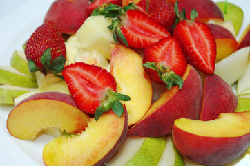 Fruit and berry salad. Strawberries, pears, apples.