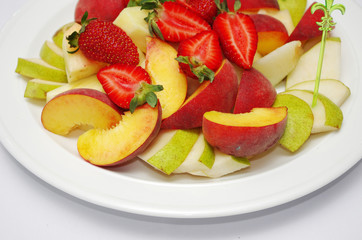 Naklejka na ściany i meble Fruit and berry salad. Strawberries, pears, apples.