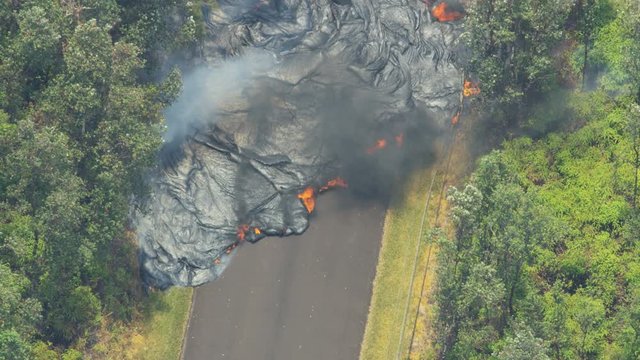 Aerial view volcanic lava cooling destroying roads property