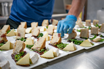 Chef Preparing Salad and Cheese Course in Kitchen