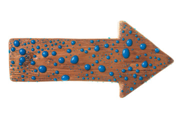 Wooden signpost with drops of blue paint. Isolated