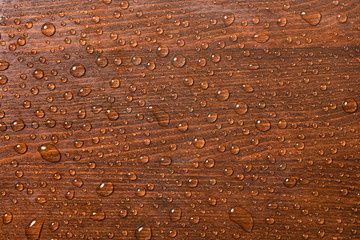 Beautiful wooden background with water drops.