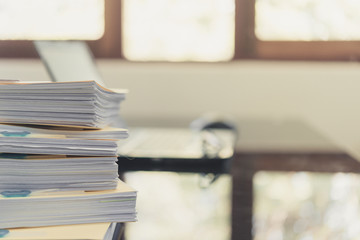 Pile of unfinished documents on office desk, Stack of business paper,Stack of documents placed on a business desk in a business office.