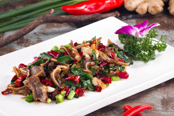 Spicy fried pork ear in a white dish