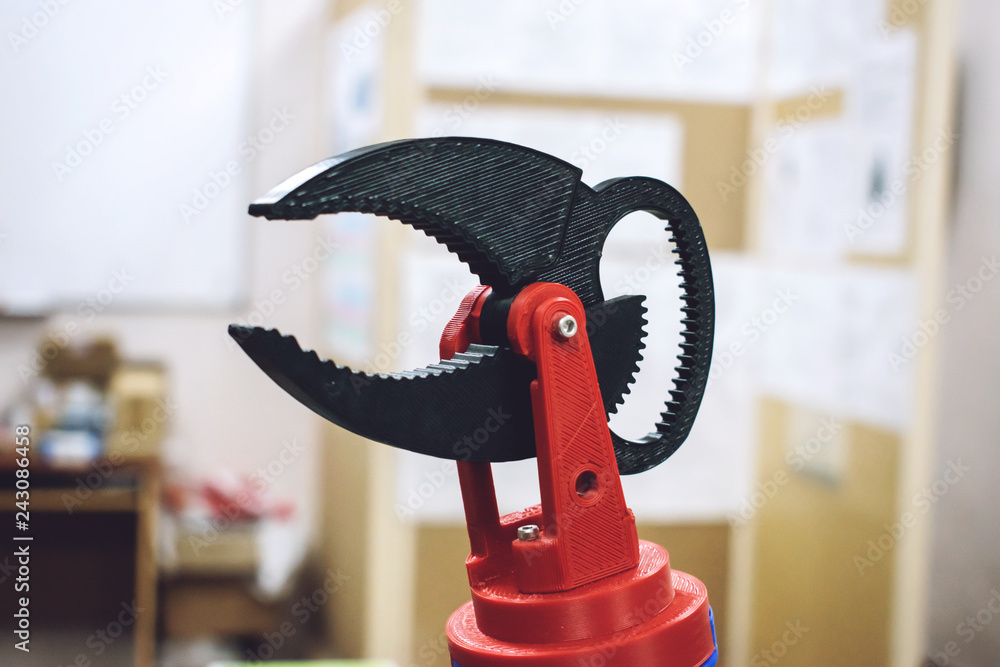 Poster 3d printed robot clamp, arm, holder. plastic manipulator, robotic hand machine tool printed on three