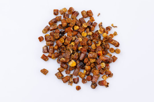 Placer of propolis on a white background. Bee product. Close-up.
