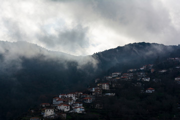 Image of village in the mountains with fog, Arcadia, Greece
