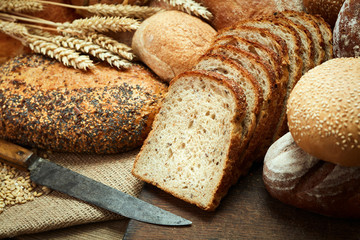 fresh baked sliced bread on wooden background