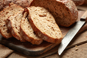 fresh baked sliced bread on wooden background