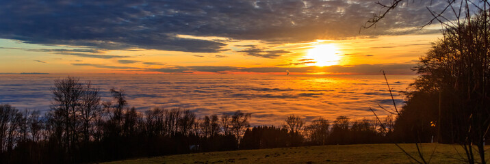 Beautiful sunset above the clouds at the Grandsberg-Schwarzach-Bavaria-Germany