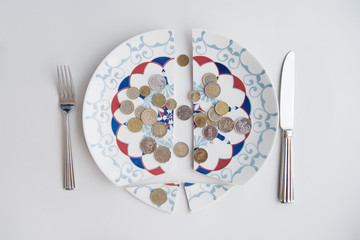 Broken plate on a white background. Money. Family budget concept. No money.