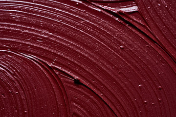 Smear of burgundy red lipstick