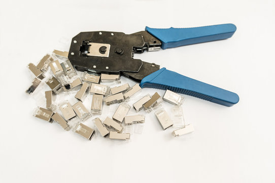 Preparation for installation of the network. The picture shows the crimping tool and connectors RJ-45 ( 8P8C)