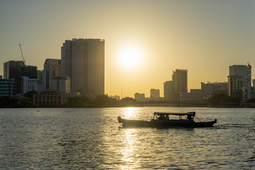 Small Local Boat in Ho Chi Minh City with beautiful Sunset in the Background