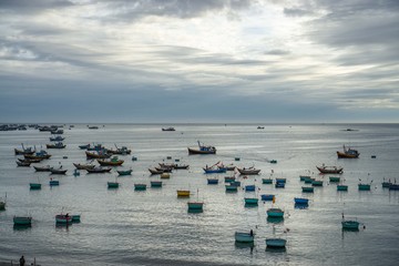 Sunset in Mui Ne Harbor with Fishing Boats returning