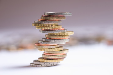 Euro coins stacked on each other in different positions