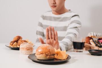 Young man in dieting and healthy eating concept