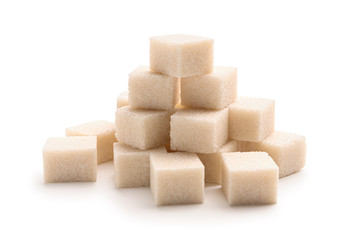Heap of sugar cubes isolated on white background