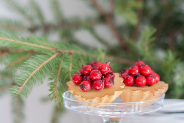 delicious christmas cupcake with glazed red berries 
