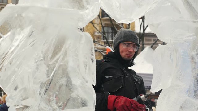 The sculptor creates an ice sculpture