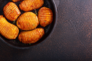 Hasselback potatoes in a pan