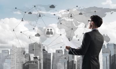 Concept of business success and control with confident boss against cityscape background