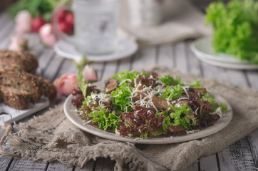 Homemade bio salad lettuce with mushrooms and wholegrain bread