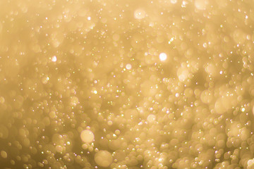 abstractr Gold background with blur bokeh light effect